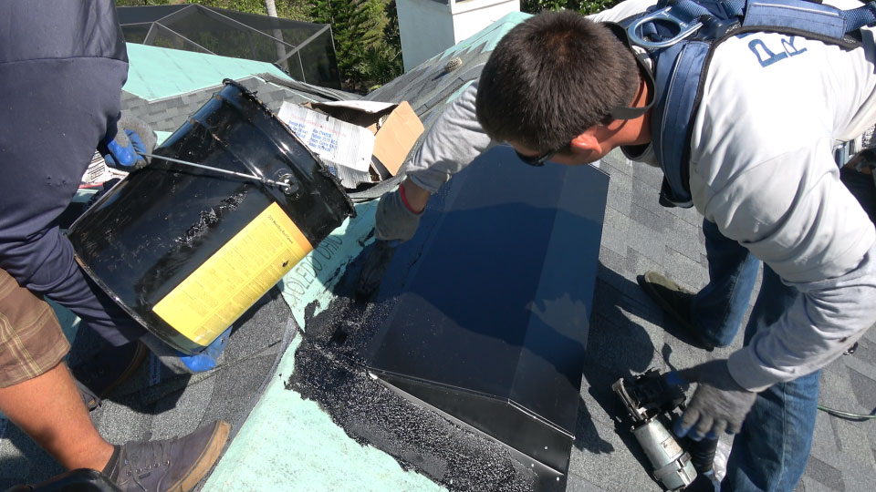 Prime Roofing crew member installing attic vents