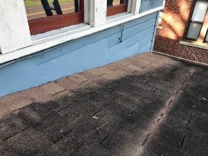 Before photo showing old, worn roof on Riverside FL home
