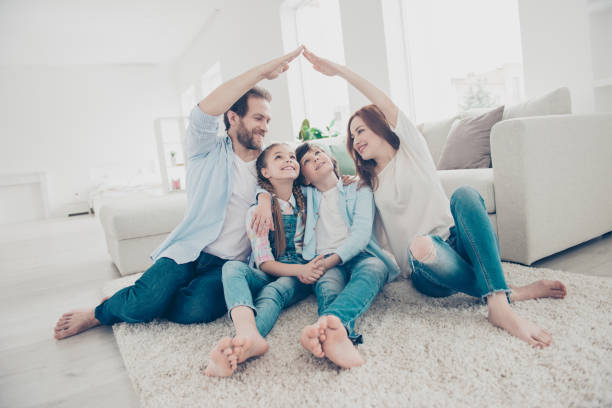 Family standing safely under a roof symbolizing homeowner insurance protection in Jacksonville, FL