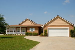 Florida home with a hip roof and asphalt shingles under a clear sky