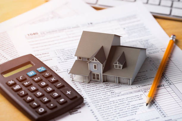 Tax documents and calculator on a desk illustrating home improvement deductions