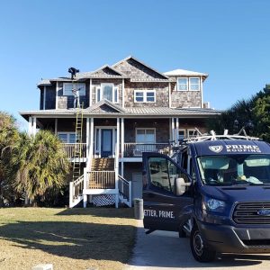 Waterfront Jacksonville home during metal roof replacement by Prime Roofing