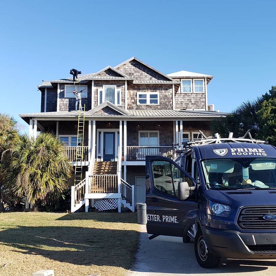 Waterfront Jacksonville home during metal roof replacement by Prime Roofing