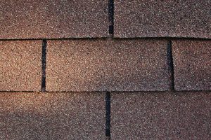 Brown reddish 3-tab asphalt shingle – a common type of roofing shingle