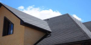 Pipe and vent flashing installed on asphalt shingle roof, essential roofing component preventing leaks