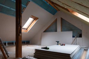 Attic renovation showing plywood and ventilation for improved insulation benefits