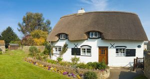 Charming cottage home with a traditional thatched roof