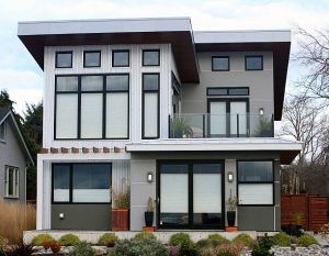 Flat roof on a modern home illustrating pros and cons for residential roofing