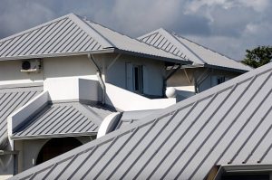Modern standing seam and metal tile roofing styles showing sleek, durable finishes—top reasons to consider a metal roof in Florida.