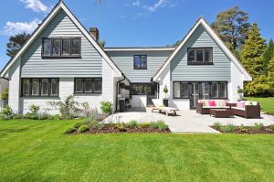 Well-maintained New England-style house showing how to make a roof last longer