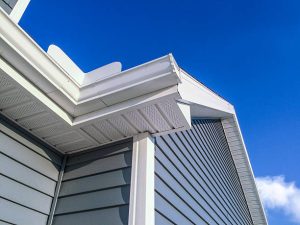 White vinyl siding installed on a home, showcasing the benefits of durability, energy efficiency, and low maintenance.