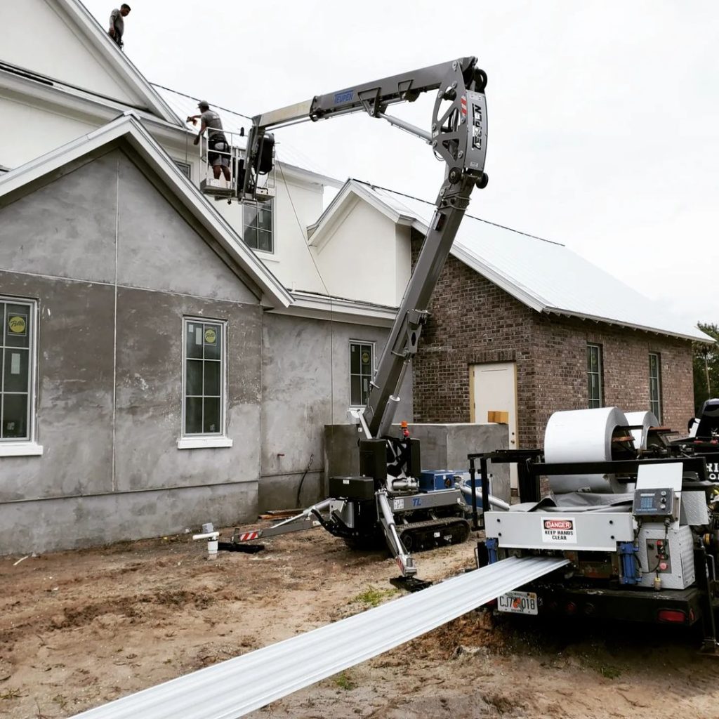Prime Roofing crew repairing a complex gable and hip roof on a brick home in St. Johns near Jacksonville FL