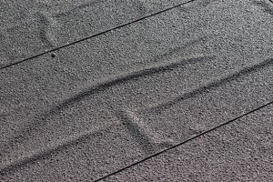 Bitumen-based roofing felt installed on a shed roof for waterproofing