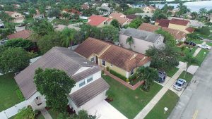 Aerial view of suburban homes showcasing various Northeast Florida roof styles