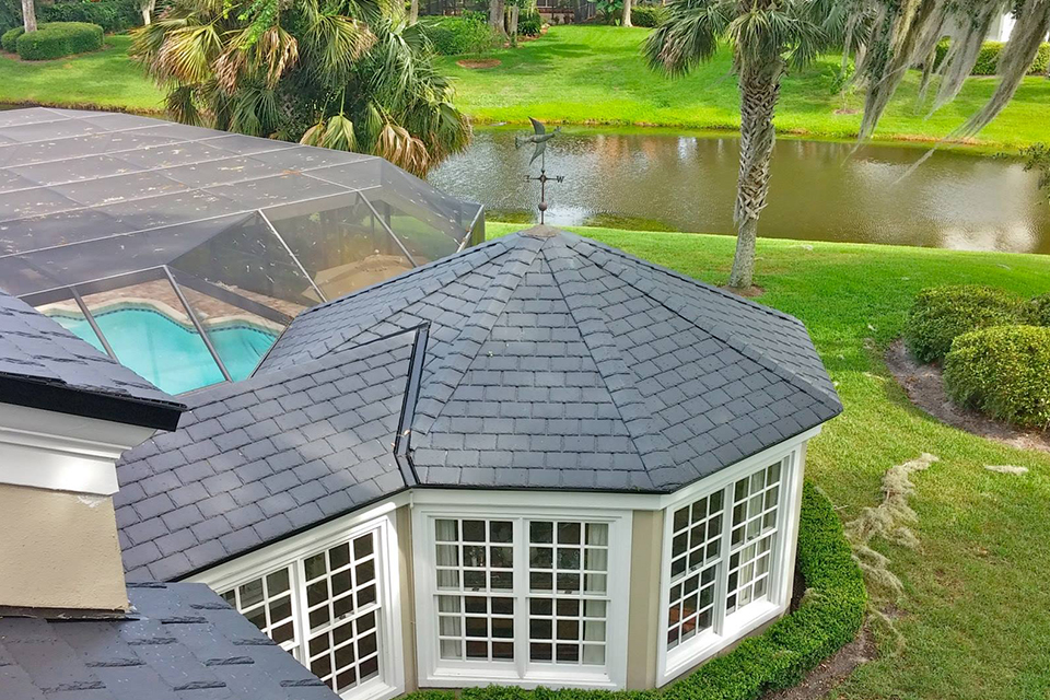 Remodeled section of asphalt shingle roof on a Florida home by Prime Roofing