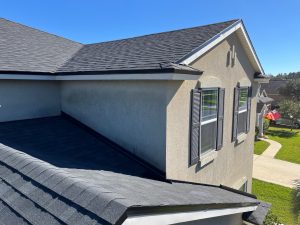 Completed Onyx Duration shingle roof installation on beige stucco home in Tallulah-North Shore Jacksonville Northside
