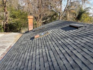 Close-up of Estate Gray shingle ridge caps on a residential roof in Atlantic Beach.