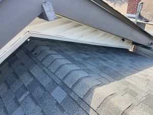 Architectural Estate Gray shingle roof valley installation in Jacksonville Florida residential roofing project