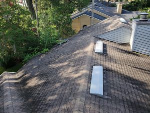 Old asphalt shingle roof before replacement in North Atlantic Beach Florida residential roofing project