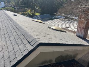 Worn out tan shingle roof before modernization in Atlantic Beach Florida.