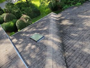 Old roof vent flashing and worn asphalt shingles before replacement in Atlantic Beach FL