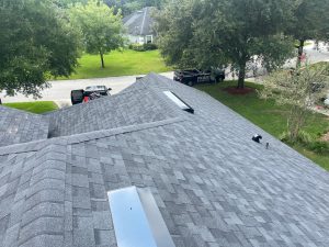 Installing Owens Corning Duration architectural shingles in Onyx Black on a residential roof in St. Augustine.