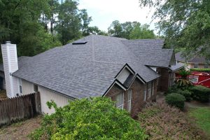 Completed architectural shingle roofing project with new ridge caps in the 32258 zip code of Jacksonville FL.