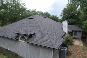 High-angle overview of a finished residential shingle roof installation in Mandarin, Jacksonville, Florida.