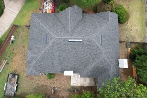 Close-up of newly installed Owens Corning Williamsburg Gray shingles in a clean roof valley in Mandarin FL.